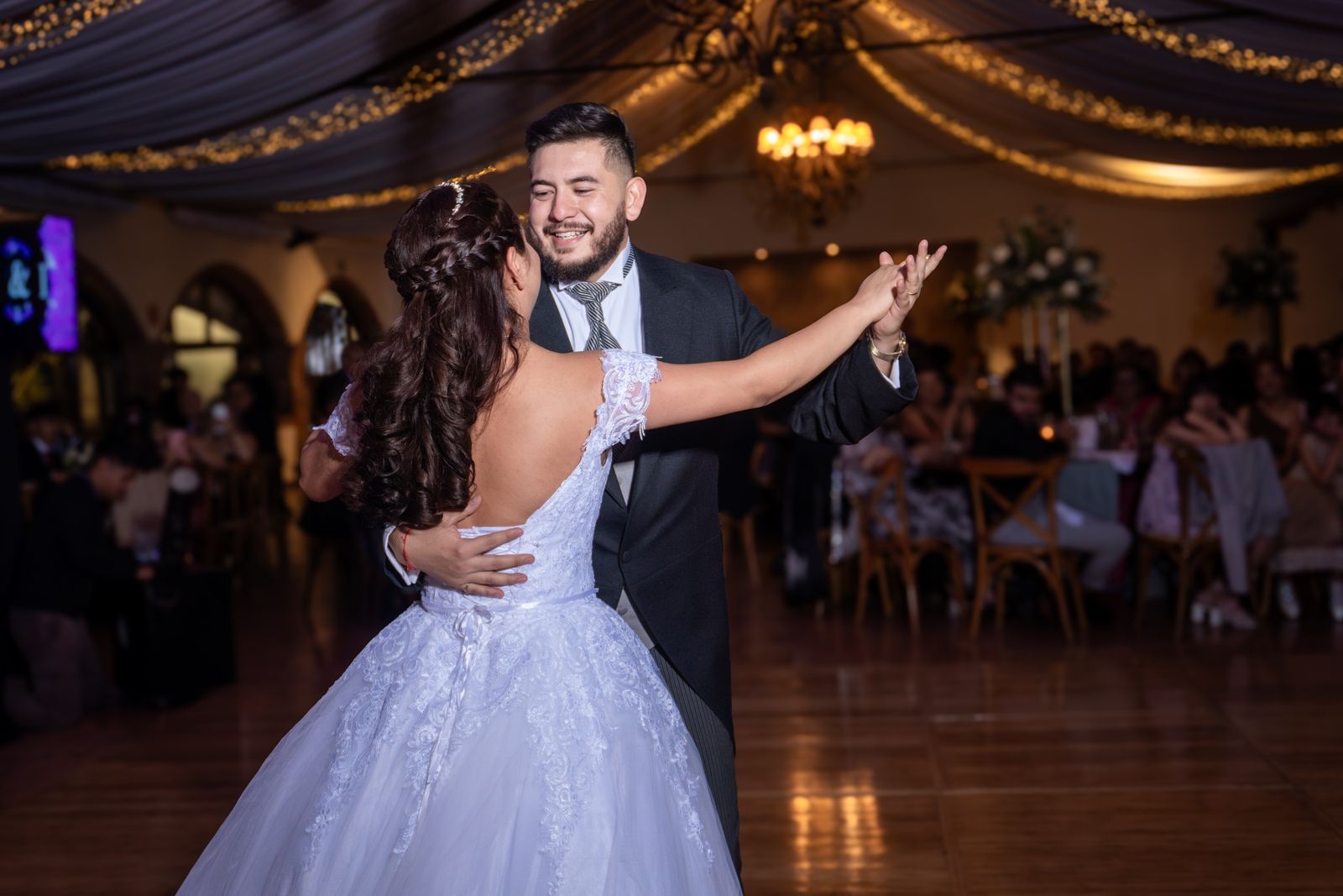 Bride and groom sharing a dance at their wedding reception